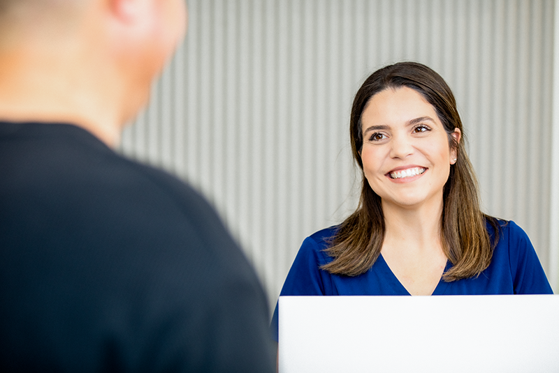 Staff member talking with pet parent at the office